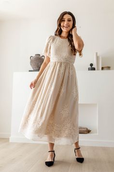 Modest Daywear Dresses With Smocked Cuffs, Elegant Beige Smocked Dress, Modest Midi Dress With Lace Trim, Elegant Fitted Smocked Dress With Lace Trim, Spring Modest Smocked Dress, Spring Modest Smocked Dress With Smocked Back, Modest Smocked Midi Dress, Modest Smocked Midi-length Dress, Modest Fitted Dress With Floral Embroidery