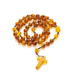 Amber Catholic rosary. These semi-precious Baltic amber rosary beads in the colors shown in the foto. In addition, we enriched it with delicate details - a hand-carved rose flower made of real Baltic Amber with a unique natural texture. Material: Baltic amber Length of the rosary with the cross: 44 cm. Circumference: 59cm. Cross length: 30 mm. Cross width: 19 mm. Bead size: 8mm. Weight: 19g. Baltic amber is renowned for its calming properties and the powerful energy it holds. Imagine feeling the strength of the sea waves with every bead you touch. As you move each amber bead through your fingers, experience a sense of peace and tranquility enveloping you. Additional Information: Gift Packaging: Each rosary is beautifully packaged in a gift box featuring our Mariiel logo, making it a perfec Catholic Rosary, The Rosary, Rosary Catholic, Amber Beads, Rosary Beads, Sea Waves, Delicate Details, Baltic Amber, The Cross