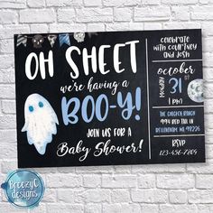 a chalkboard sign on a brick wall that says, oh sheet we're having a booy baby shower