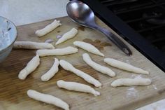 the food is being prepared and ready to be put into the oven for baking on the cutting board