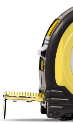 a yellow and black tape measure on a white background