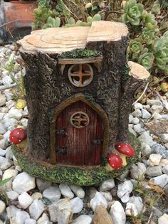 a small tree stump with a house on it