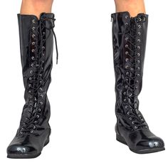 a pair of black boots with laces on the side and heeled heels in front