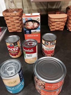 several canned food items on a counter top