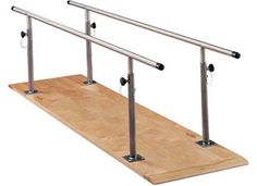 a wooden board with metal bars on it and two poles attached to the top of each pole