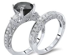 two wedding rings with black and white diamonds