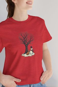 Snowman Shirts For Women - Christmas Cute Gift This unisex t-shirt has a design inspired by the Christmas Holiday and includes Snowman, a dog and a tree...  The shirt could be a perfect gift for mom, mother, sister, brother, husband, wife or for a good friend.  This classic unisex jersey short-sleeve tee fits like a well-loved favorite. Soft cotton and quality print make users fall in love with it over and over again. These t-shirts have ribbed knit collars to bolster shaping. The shoulders are tapered for a better fit over time. Dual side seams hold the garment's shape for longer. #christmas #snowman #shirt #gift #Woman Snowman Shirts, Snowman Shirt, Christmas Cute, A Good Friend