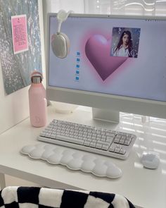 a desk with a computer, keyboard and mouse on it