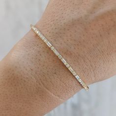 Our double round baguette diamond bracelet makes a lovely bridal bracelet or anniversary gift. It matches our Toryn diamond eternity band -- and most of our brides who purchase the Toryn add this bracelet to their collection as well! Available in 14k and 18k yellow, rose or white gold as well as platinum, and with either natural or lab-grown diamonds -- just choose your desired diamond type and metal from the drop-down menus before checkout. Prefer larger diamonds? Colored gemstones/birthstones? Anniversary Diamond Bracelet With Baguette Diamonds, White Gold Baguette Diamond Bracelet For Anniversary, Fine Jewelry Round Diamond Bracelet With Baguette Diamonds, Round Diamond Bracelet With Baguette Diamonds, Fine Jewelry Diamond Bracelet With Baguette Diamonds, Baguette Cut Diamond Bracelet With Diamond Accents For Anniversary, Anniversary White Gold Baguette Bracelets, Anniversary Baguette White Gold Bracelets, Classic Diamond Bracelet With Baguette Diamonds For Anniversary