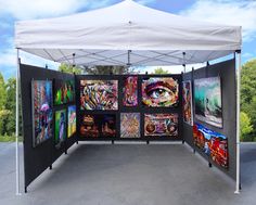 an outdoor tent with paintings on it