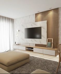 a living room filled with furniture and a flat screen tv on top of a wall