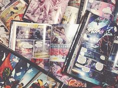 an assortment of comic books spread out on top of each other, including one with the same character