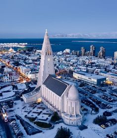 an aerial view of a city with snow on the ground