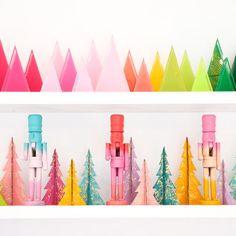 colorful christmas decorations on shelves with candy canes