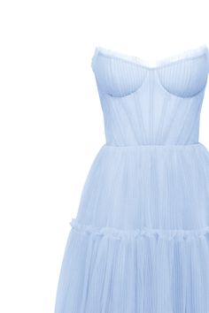 Dreamy tulle dress in light blue color with a light ruffled tulle maxi skirt. This dress has a heart-shaped boned semi-transparent bodice with built-in cups and a corset back, which makes the silhouette fitted and elegant. The A-line maxi skirt is made from multiple layers of delicate tulle that emphasize the hourglass silhouette. The waistline is adorned with a silver belt with Milla’s signature. Details: Material: Tulle Fabric composition: 100% Polyester, 100% Nylon Sleeve style: Sleeveless Silhouette: A-line Skirt length from waist: 116 cm / 45.6 inches Dress weight: 1.14 kg / 2.5 lbs Neckline: Heart-shaped neckline Back: Lacing closure Lining: Light blue full-length flared underskirt Model is: 180 cm / 83-60-95, wearing size S Art.N.: 9000-10 Light Blue Light Blue Sheer Bodice Party Dress, Light Blue Party Dress With Sheer Bodice, Light Blue Tulle Dress For Evening, Blue Tulle Dress With Lined Bodice, Light Blue Sheer Bodice Dress For Party, Party Dress With Sheer Bodice In Light Blue, Light Blue Floor-length Tulle Dress, Light Blue Tulle Dress For Prom Season, Blue Dress With Sheer Bodice And Sweetheart Neckline