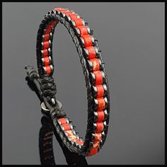 This handmade natural gemstone bracelet made with 2*4 mm roundel red variscite with 1*4 mm Hematite. It is a perfect gift for you and all your loved one for all special days. All our designs prepared by hand according to the your given sizes with love. Wrap is durable 1,5 mm polyester black rope. For closure of our high quality bracelet we used zamak alloys button with 2 optional closure buttonhole. We offer 8 size option between 5.9-8.7 inches (15-22 cm) , please DM us to demand different wrist size. Used Materials; 4*2 mm red variscite 4*1 mm hematite 1 cm zamak alloys button 1.5 mm black korean rope ☆ABOUT US☆ https://www.etsy.com/shop/SevenArtJewelry?ref=listing-shop2-all-items-count#about ☆OUR POLICIES☆ https://www.etsy.com/shop/sevenartjewelry#policies Thanks for your visit Seven Art Adjustable Red Coral Jewelry, Adjustable Round Red Coral Jewelry, Adjustable Red Coral Jewelry Gift, Red Adjustable Leather Bracelet, Bohemian Style, Gift Red Coral Bracelet With Gemstone Beads, Handmade Adjustable Red Leather Bracelet, Red Wrap Bracelet With Round Beads, Red Hand Wrapped Round Jewelry, Adjustable Leather Bracelet With Round Beads As Gift