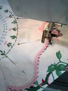 the sewing machine is working on the fabric