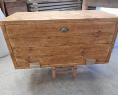 an old wooden chest sitting in a warehouse