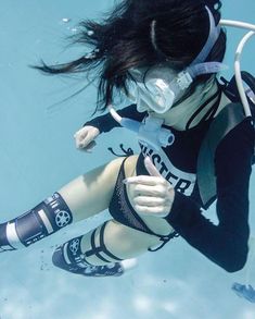 a woman wearing diving gear in the water