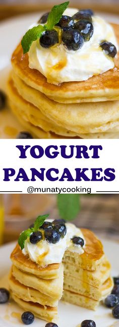 blueberry pancakes with yogurt and cream on top are stacked on a white plate