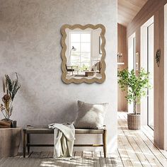 a room with a chair, mirror and potted plant