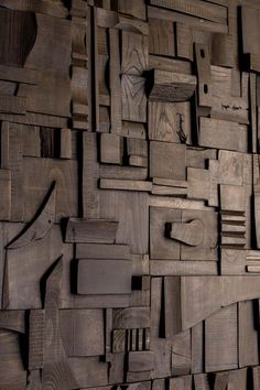 a wall made out of wooden planks and pieces of wood