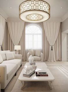 a living room with white furniture and curtains