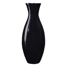 a black vase sitting on top of a white table