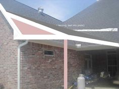 an outside view of a brick house with a white awning