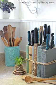 kitchen utensils and wooden spoons are sitting on the counter