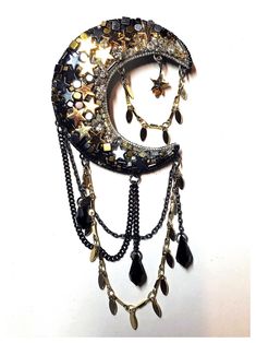 Handcrafted brooch made from: - glass and crystal beads in shades of gold, silver and black - includes Swarovski Crystal drops, and gold-plated and black hematite stars - revolver bar brooch metal fastening to back Dimensions: - moon: 5.5cm x 5cm (LxW) - moon plus chain: 11cm x 5cm (LxW) Black Metal Brooch Jewelry, Black Brooch Jewelry For Party, Black Party Jewelry Brooch, Black Brooch Pins For Party, Black Party Brooch Pins, Moon Beads, Stars Gold, Bead Hair Accessories, Bar Brooch