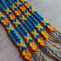 several different colored beads on a table