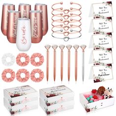 the contents of a rose gold wedding kit including champagne flutes, roses and other items