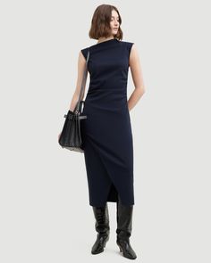 The elevated midi dress is a wardrobe must-have — Manon exudes effortless polish with its asymmetric neckline, ruched sides, and wrap front. We love to style it with a sleek pair of heeled boots for a desk-to-drinks look. See below for our general Size Guide and available measurements Made of 73% rayon, 23% nylon, and 4% spandex Machine wash cold and lay flat to dry Asymmetric Neckline, Ruched Dress, Lay Flat, Heeled Boots, Size Guide, Must Haves, Night Out, Midi Dress, Sleek