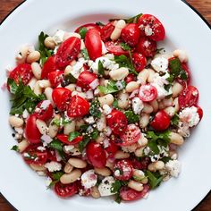 a white plate topped with beans and tomatoes