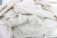 a pile of white cloth sitting on top of a table