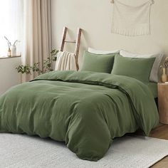 a bed in a bedroom with a brown comforter on top of it and a white rug