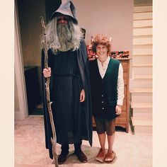 two people dressed in costumes standing next to each other