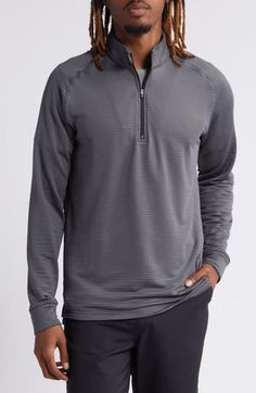 Lightweight and stretchy, this pullover made with a sporty waffle texture swings you from links to lunch in a layerable fit that delivers 18-hole comfort. Quarter-zip closure Stand collar Banded cuffs and hem 92% polyester, 8% spandex Machine wash, tumble dry Imported Gray Athleisure Sweater For Sports, Winter Golf Tops With Long Sleeves, Sporty Waffle Knit Long Sleeve Tops, Sporty Long Sleeve Waffle Knit Top, Sporty Tops For Golf In Fall, Sporty Golf Tops For Fall, Sporty Long Sleeve Sweatshirt For Golf, Sporty Half-zip Tops For Layering, Sporty Gray Half-zip Top