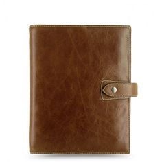 a brown leather notebook with a button on the front