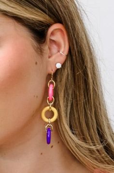 Make a statement with these unique Three Colorful Rings Earrings! Whether you want to add a pop of color to a simple outfit, or make a loud and proud fashion statement, these earrings are the perfect accessory. Add a touch of color and sparkle to your wardrobe!Details: Colorful Dangle Earrings Three Colorful Rings French Hook Ear Wire for Pierced Ears Approximate Dimensions: Length: 3.5" Rings: 0.75" DiameterRed, White and Blue ComboPink, Yellow and Purple Combo Trendy Round Summer Jewelry, Trendy Circular Earrings For Summer, Trendy Circular Summer Earrings, Trendy Multicolor Jewelry For Everyday, Modern Multicolor Single Earring, Trendy Multicolor Everyday Jewelry, Bold Dangle Jewelry For Party, Trendy Colorful Dangle Hoop Earrings, Trendy Circle Earrings With Ear Wire