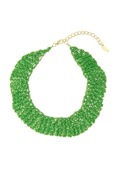 a green necklace on a white background