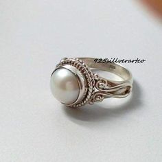 WELCOME MY SHOP    Pearl Ring, 925 Silver Ring, Handmade Ring, Beautiful Jewelry Ring, White Pearl ring, Round Pearl, Designing Ring, Special Occasion Ring, Product Detail: Metal : 925 Sterling Silver ring Stone : Pearl  Stone Color : White Stone Shape : Round  All Size Available This Ring have 925 Stamp. The perfect gift for a Special occasion. Wholesale Orders Accept on Wholesale Price. Fast shipping after Payment Received FEEDBACK := We Always Believe In Customer Satisfaction, Your Feedback I Old Rings Vintage Pearl, Pearl Ring Design, Pearl Rings Vintage, White Pearl Ring, Womens Rings Fashion, Pearl And Diamond Ring, Fresh Water Pearl, Blue Nile, 925 Silver Jewelry