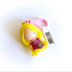 a plastic keychain with a little princess doll on it's side and a price tag attached to it