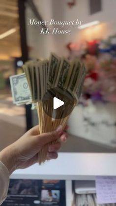 a person holding money in their hand with the words money brought by k k house