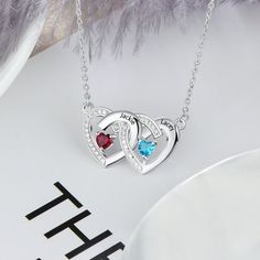 Personalized 2 Stone Mother's Necklace Paved Hearts 2 Engraved Names Can be used as a mother's necklace, friendship necklace, or couple's necklace. You can choose 2 birthstone months and can have 2 names engraved on this necklace. Please enter the information in the box at checkout or message us after checkout. Enter like this, please- Birthstone month 1- Birthstone month 2- Name 1- Name 2- Made from .925 sterling silver. We hand-make this piece once the order is placed.  This takes 3-5 business Double Heart Birthstone Necklaces For Anniversary Gift, Mother's Day Double Heart Necklace With Heart Beads, Double Heart Necklace For Anniversary And Mother's Day, Double Heart Birthstone Necklace For Anniversary, Heart Beads Necklaces For Anniversary And Mother's Day, Double Heart Birthstone Necklaces For Anniversary, Heart Beads Necklaces For Anniversary On Mother's Day, Anniversary Necklaces With Heart Beads For Mother's Day, Double Heart Necklace With Heart Beads For Anniversary