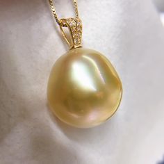 Massive South Sea Golden Pearl Pendant, 15.1mmx16mm, Bright Sunny Gold Color, Multicolored, Very High Luster.  Solid 18k Yellow Gold with sparkling cubic zircons, Very Well made. Classic and Elegant.   Classic and Elegant    Lustrous Beauty   Super Value  Pearl ★ Pearl: Genuine South Sea Golden Pearl, Saltwater  ★ Origin: Philippines ★ Pearl: 15.1mmx16mm ★ Shape: Big Drop ★ Color: Natural untreated, Bright Sunny Gold Color, Multicolored, Beautiful ★ Luster: Very High Luster, Wonderful ★ Surface: Golden Pearl, South Seas, Pearl Pendant, Sunnies, Jewelry Necklace Pendant, Gold Color, Jewelry Necklaces, Sparkle, Yellow Gold