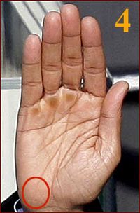 an image of a person's hand with the number 4 on it and four fingers