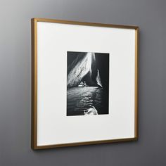 a black and white photo hanging on the wall