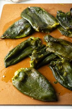 8 roasted poblano pepper on a cutting board, seeds having been removed. Poblano Pepper Salsa Recipes, Salsa With Poblano Peppers, Poblano Peppers, Creamy Poblano Sauce, Roasted Poblano Salsa, Poblano Pepper Recipes, Roasted Poblano Pepper Salsa, Poblano Recipes, Poblano Cream Sauce